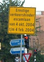 A sign about road work, but with an error in the dates